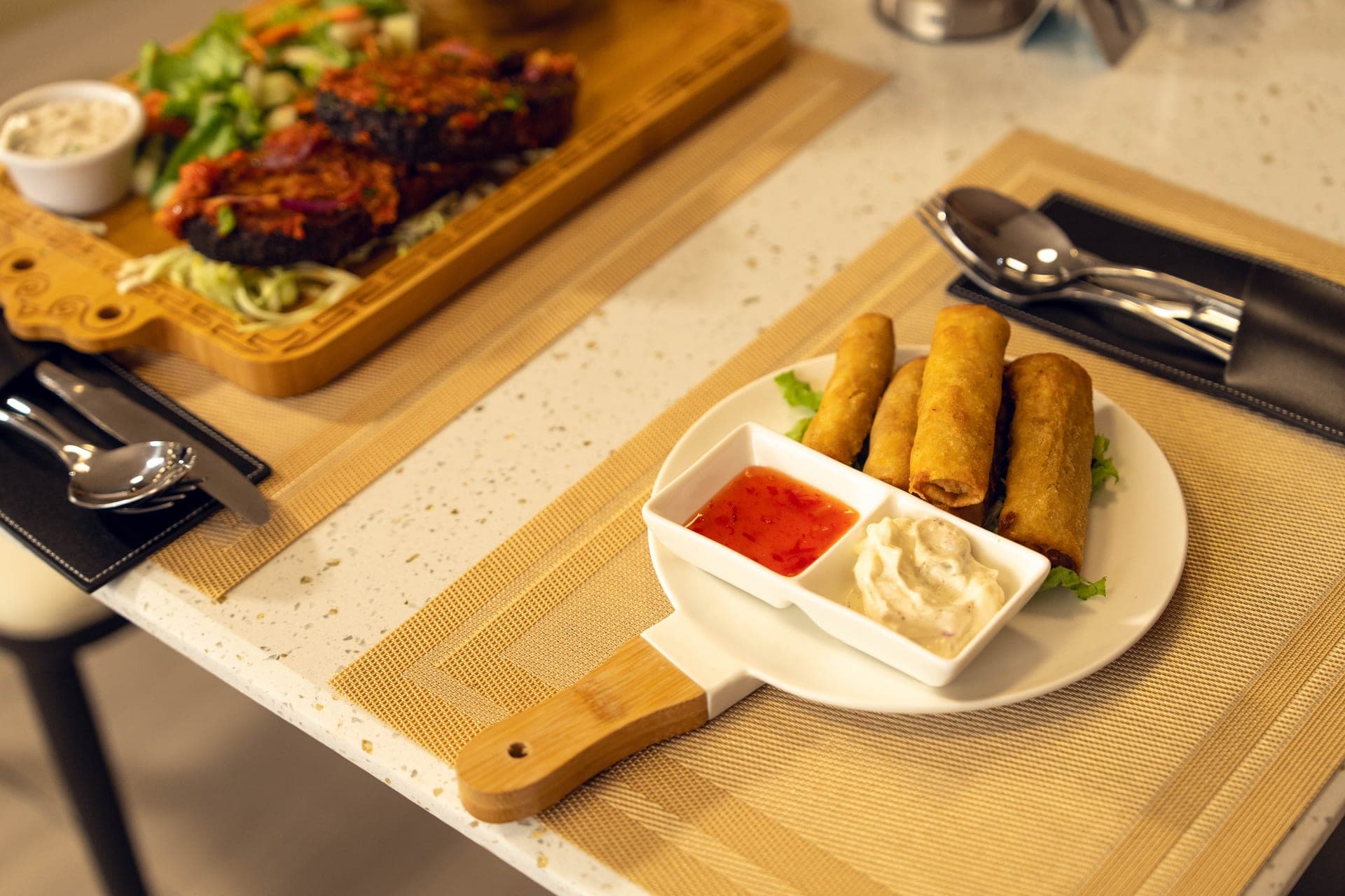 Hand-rolled gourmet appetizers and dipping sauces